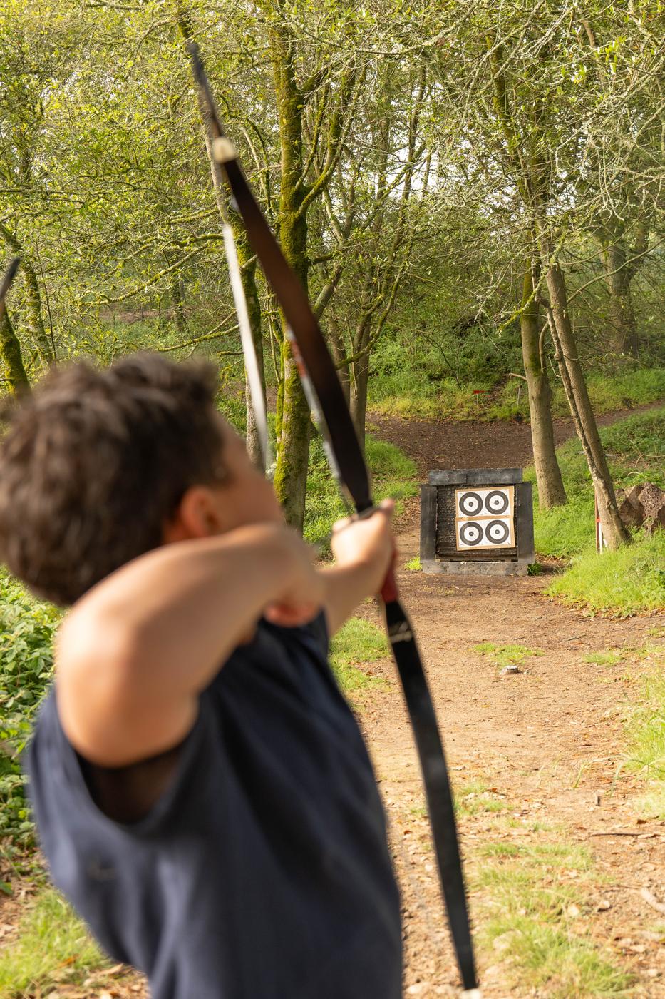 A young archer at full draw during Futuwwah 5 archery practice